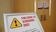 A sign designates an area for coronavirus screening at Fort Belvoir Community Hospital in Fort Belvoir, Virginia, U.S., March 18, 2020. REUTERS/Kevin Lamarque
