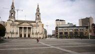 A virtually empty Millennium Square is seen in central Leeds on March 21, 2020, a day after the British government said it would help cover the wages of people hit by the coronavirus outbreak as it tightened restrictions to curb the spread of the disease.