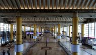 Employees walk at an empty railway station after services were shutdown by the authorities to limit the spread of the coronavirus disease (COVID-19) in Mumbai, India, March 23, 2020. REUTERS/Francis Mascarenhas