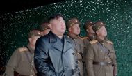 This picture taken on March 21, 2020 and released from North Korea's official Korean Central News Agency (KCNA) on March 22, 2020 shows North Korean leader Kim Jong Un observing the demonstration fire of tactical guided weapons at an undisclosed location 