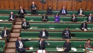 A handout photograph released by the UK Parliament shows Britain's Health Secretary Matt Hancock standing at the dispatch box and speaking during the Coronavirus Bill debate to socially distanced MPs in the House of Commons in London on March 23, 2020.  A