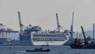 The Diamond Princess cruise ship is seen at a pier in the port of Yokohama on March 25, 2020. / AFP / Kazuhiro NOGI

