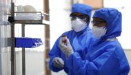 FILE PHOTO: Medical staff with protective clothing are seen inside a ward specialised in receiving any person who may have been infected with coronavirus, at the Rajiv Ghandhi Government General hospital in Chennai, India, January 29, 2020. REUTERS/P. Rav