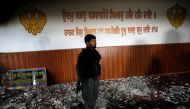 An Afghan policeman inspects inside a Sikh religious complex after an attack in Kabul, Afghanistan March 25, 2020.REUTERS/Mohammad Ismail