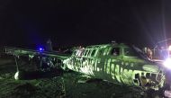 Debris of the crashed plane are seen at Pasay City, Metro Manila, Philippines, March 29, 2020. Manila International Airport Authority Media Affairs Division/Handout via REUTERS