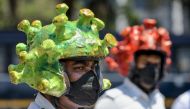 Traffic policemen wearing coronavirus-themed helmets in a campaign to educate the public during lockdown against the COVID-19 in Bangalore on March 31, 2020. AFP / Manjunath Kiran