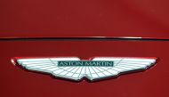 FILE PHOTO: A logo on the new Aston Martin DBX at the new Aston Martin Lagonda factory in Barry, Wales, Britain February 21, 2020. REUTERS/Rebecca Naden