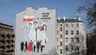 A mural showing medical personel wearing protective masks is painted on a wall of a building following the coronavirus disease (COVID-19) outbreak in Warsaw, Poland, April 1, 2020. Slawomir Kaminski/Agencja Gazeta via REUTERS