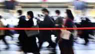 Tokyo, JAPAN - APRIL 2 : People wearing face masks are seen during the rush hours amid restrictions against the spread of coronavirus (COVID-19) pandemic in Tokyo, Japan on April 02, 2020.  ( David Mareuil - Anadolu Agency )
