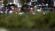 Drivers wearing protective face masks, following an outbreak of the coronavirus disease (COVID-19), are seen inside taxies at a taxi park in Tokyo, Japan April 3, 2020. REUTERS/Issei Kato
