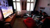 Malte and Rasmus Bruhn play a video game after dinner at home as the spread of the coronavirus disease (COVID-19) continues in Berlin, Germany, April 1, 2020. REUTERS/Fabrizio Bensch