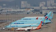 FILE PHOTO: Korean Air's passenger planes are parked at on the tarmac as overseas flight routes are reduced following the outbreak of coronavirus disease (COVID-19), at Incheon International Airport in Incheon, South Korea, March 24, 2020. REUTERS/Heo Ran