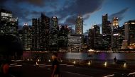 file photo: A man wearing a mask in precaution of the coronavirus looks on along the Marina Bay Waterfront Promenade in Singapore February 19, 2020. REUTERS/Edgar Su