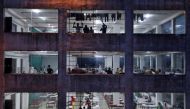 FILE PHOTO: People are seen inside a temporary quarantine centre, during an extended nationwide lockdown to slow the spread of the coronavirus disease (COVID-19), in Kolkata, India, April 15, 2020. REUTERS/Rupak De Chowdhuri/File Photo