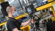 A worker assembles an engine for a Mercedes-Benz S-class model at the Daimler Powertrain plant in Bad Cannstatt, as the spread of the coronavirus disease (COVID-19) continues near Stuttgart, Germany, April 22, 2020. REUTERS/Andreas Gebert