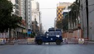 A police vehicle blocks a road in a business district during a lockdown in efforts to stem the spread of the coronavirus disease (COVID-19), as the Muslim fasting month of Ramadan begins in Karachi, Pakistan April 25, 2020. REUTERS/Akhtar Soomro
