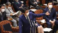 Japan's Prime Minister Shinzo Abe wearing a face mask speaks during a budget committee session at the parliament in Tokyo on 29 April 2020. Japan OUT / AFP / JIJI PRESS / STR