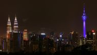 Buildings are seen illuminated in blue as part of the 
