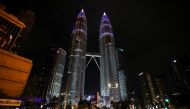 Petronas Twin Towers are seen illuminated in blue as part of the 