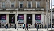 People queue outside an AIB Bank in Dublin City Centre, following the outbreak of the coronavirus disease (COVID-19), Dublin, Ireland, May 1, 2020. REUTERS/Jason Cairnduff