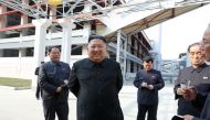This picture taken on May 1, 2020 and released from North Korea's official Korean Central News Agency (KCNA) on May 2, 2020 shows North Korean leader Kim Jong Un (2nd L) visiting the completed Suchon phosphate fertilizer factory in South Pyongan Province,