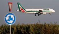 FILE PHOTO: An Alitalia Airbus A320-200 airplane approaches to land at Fiumicino airport in Rome, Italy October 24, 2018. REUTERS/Max Rossi