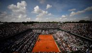 (FILES) In this file photo taken on June 8, 2018 Spectators watch Spain's Rafael Nadal (TOP) as he plays Argentina's Juan Martin del Potro during their men's singles semi-final match on day thirteen of The Roland Garros 2018 French Open tennis tournament 
