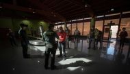 Spanish Civil Guards check documents allowing passengers to travel at Los Cangrejos airport on the Canary Island of El Hierro on May 11, 2020. Spaniards returned to outdoor terraces at cafes and bars as around half of the country moved to the next phase o