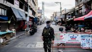 FILE PHOTO: A soldier wearing a face mask holds on his weapon as he guards an empty street following the lockdown imposed to contain the coronavirus disease (COVID-19) in Manila, Philippines, April 24, 2020. REUTERS/Eloisa Lopez/File Photo
