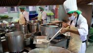 Volunteers cook free lunch for low-income communities during the coronavirus disease (COVID-19) outbreak in Bangkok, Thailand May 13, 2020. REUTERS/Soe Zeya Tun