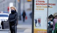 A masked woman is seen in Moscow, Russia on May 15, 2020. It is made compulsory to wear masks and gloves in public transport, including taxis, workplaces, markets and crowded environments.  Sefa Karacan - Anadolu
