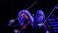Musicians of the Ukrainian Radio Symphony Orchestra wear protective face masks as they take part in one of the first rehearsals after an easing of lockdown measures imposed to curb the spread of the coronavirus disease (COVID-19) in Kiev, Ukraine May 15, 