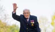 Capt. Tom Moore, a British war veteran who was then 99, reacts after completing the 100th length of his back garden in Marston Moretaine, Bedfordshire, Britain, on April 16. Vickie Flores/EPA-EFE/REX/Shutterstock.