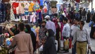 People shop at a market ahead of the Muslim Eid al-Fitr festival in Karachi on May 20, 2020. AFP / Asif HASSAN /