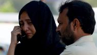 Mourners waits outside the mortuary of Edhi Foundation to receive the body of a victim for a burial a day after a Pakistan International Airlines aircraft crashed in a residential area in Karachi on May 23, 2020.  AFP / Rizwan TABASSUM