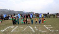 FILE PHOTO: Afghan children celebrate in anticipation of the U.S-Taliban agreement to allow a U.S. troop reduction and a permanent ceasefire, in Jalalabad, Afghanistan February 28, 2020. REUTERS/Parwiz

