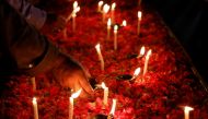 People light oil lamps and candles for the victims of the Pakistan International Airlines's PK8303 plane crash, in Karachi, Pakistan May 27, 2020. REUTERS/Akhtar Soomro