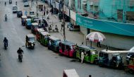 Auto-rickshaws line up along roadside after the government resumed public transport services, in Pakistan's port city of Karachi on June 3, 2020. Pakistan's Prime Minister Imran Khan announced on June 1 his government would end several months of coronavir