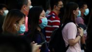 People cross a street during morning peak hour commute amid the coronavirus disease (COVID-19) outbreak in Singapore June 3, 2020. REUTERS/Edgar Su
