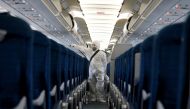 A health worker sprays disinfectant inside a Vietnam Airlines airplane to protect from the recent coronavirus outbreak, at Noi Bai airport in Hanoi, Vietnam February 21, 2020. REUTERS/Kham - RC2U4F9KDLO4/File Photo
