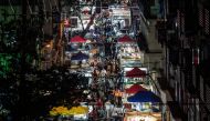 TOPSHOT - This photo taken on June 3, 2020 shows people visiting a night market in Wuhan in China's central Hubei province. China OUT / AFP / STR