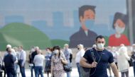 People wearing masks as a precaution against coronavirus (Covid-19) wait in a queue as lockdown was lifted in Moscow, Russia on June 9, 2020. ( Sefa Karacan - Anadolu Agency )