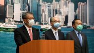 Hong Kong Financial Secretary Paul Chan (L), wearing a face mask following the coronavirus disease (COVID-19) outbreak, attends a news conference on the bailout of Cathay Pacific in Hong Kong, China June 9, 2020. REUTERS/Laurel Chor