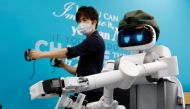 Mira Robotics CEO Ken Matsui operates an Ugo avatar robot during a demonstration at the company's laboratory in Kawasaki, Japan June 8, 2020. Picture taken June 8, 2020. REUTERS/Kim Kyung-Hoon