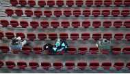 Fans sit with social distancing for an Australian Football League (AFL) match between the Port Adelaide Power and Adelaide Crows amidst the easing of the coronavirus disease (COVID-19) restrictions at Adelaide Oval in Adelaide, Australia, June 13, 2020. A