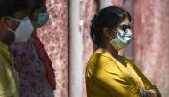 This photo taken on June 6, 2020 shows Kashish Jain (R), daughter of the late Ashwani Jain, standing before an interview with AFP in New Delhi./ AFP / Sajjad HUSSAIN /