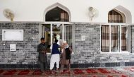Men inspect the site of a blast inside a mosque in Kabul, Afghanistan June 12, 2020.REUTERS/Mohammad Ismail