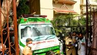 An ambulance carrying the body of Indian Bollywood actor Sushant Singh Rajput is seen leaving after he took his own life, at his residence in Mumbai on June 14, 2020. AFP / INDRANIL MUKHERJEE