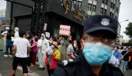 People crowd outside the Guangan Sport Center to get tested after an unexpected spike of cases of the coronavirus disease (COVID-19) in Beijing, China June 15, 2020. REUTERS/Thomas Peter
