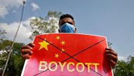 A member of National Students' Union of India (NSUI) holds a placard during a protest against China, in Ahmedabad, India, June 18, 2020. REUTERS/Amit Dave
 